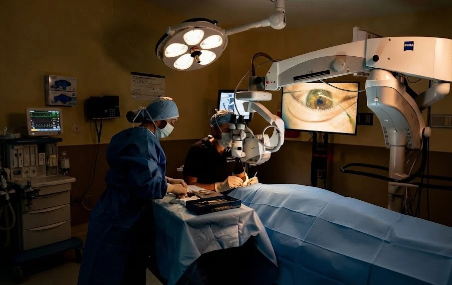 Surgeons performing Phaco eye surgery in an operating room.   