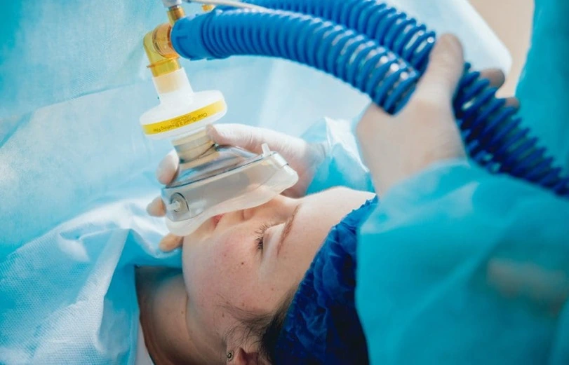 Doctors performing sedation for eye surgery.
