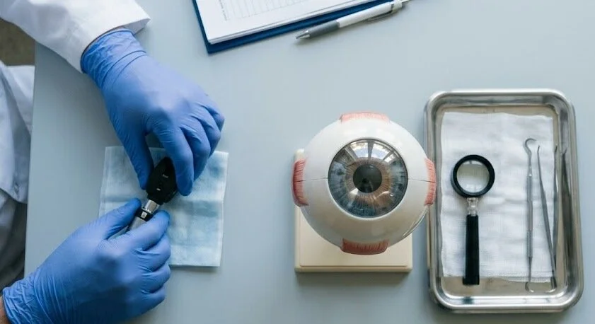diagnostic preparation next to eye model - Cornea eye surgery- 1